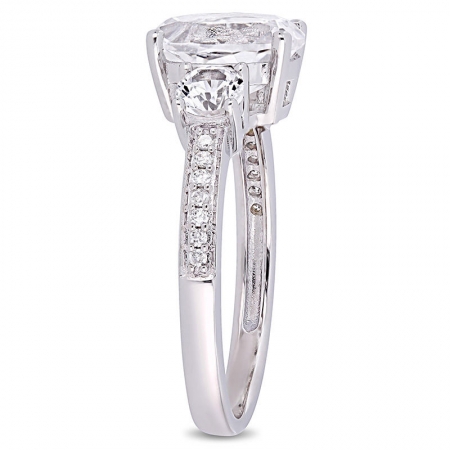 Помолвочное кольцо из белого золота с белым  овальным и курглыми сапфирами  и бриллиантами